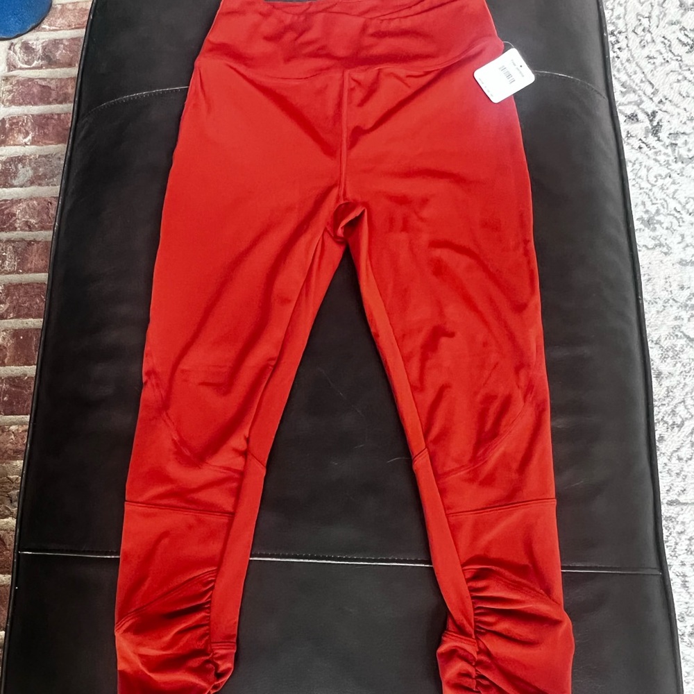 NWT. Rust color Free People Movement leggings. Gathered at the ankles.